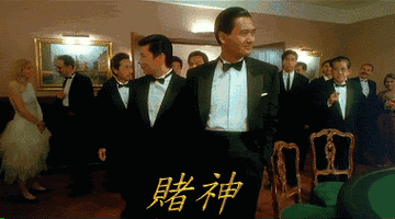 所饰演的赌神这是永远的男神周润发牌桌上更是运筹帷幄志在必得风度