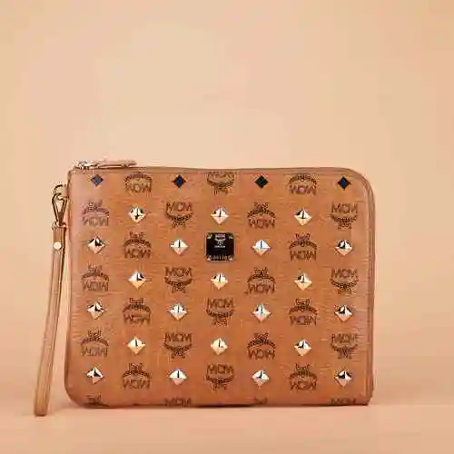 【准新】mcm铆钉款黄色经典色手拿